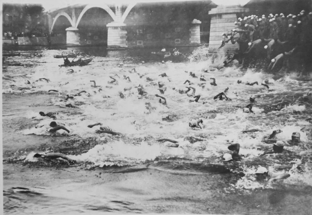 Swimmers in Seine River for the Traversée de la Nage swimming competition in Paris