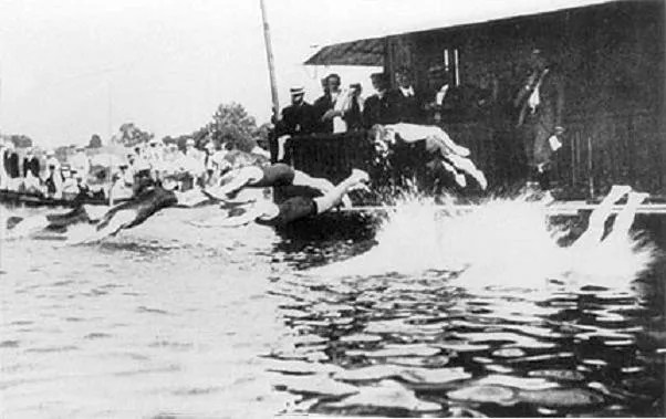 Athletes swim the Seine River for the 1900 Paris Summer Olympics