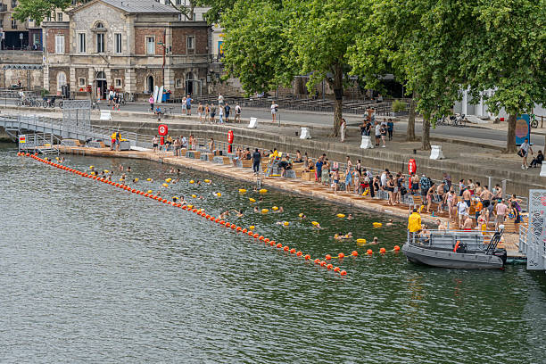 Bathers swim in the Seine River in Paris.